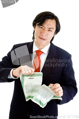 Image of Upset Asian Man Suit Tearing Stock Certificate