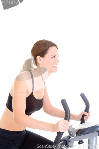 Image of Smiling Caucasian Woman Riding Exercise Bike White Background