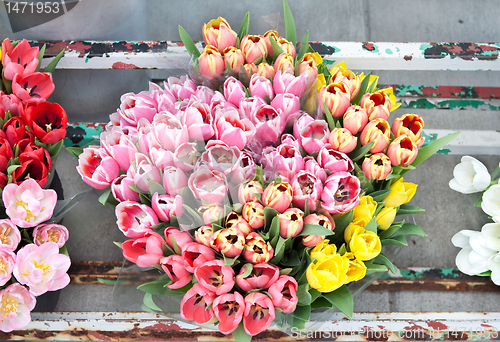 Image of Bouquet of Flowers Tulips in a Old Metal Flourist Display