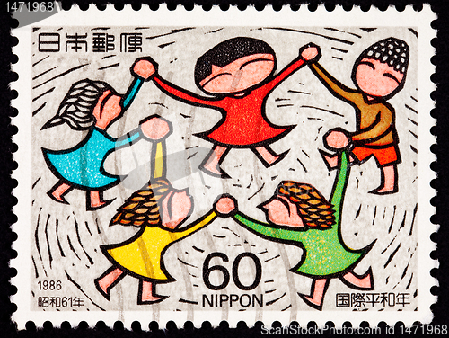 Image of Canceled Japanese Postage Stamp Multicultural Children Holding H