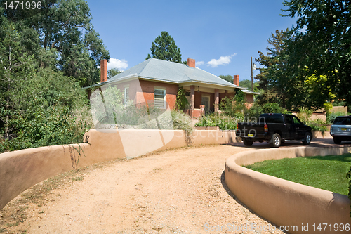 Image of Brick Home Santa Fe, New Mexico Gravel Drive Adobe Wall