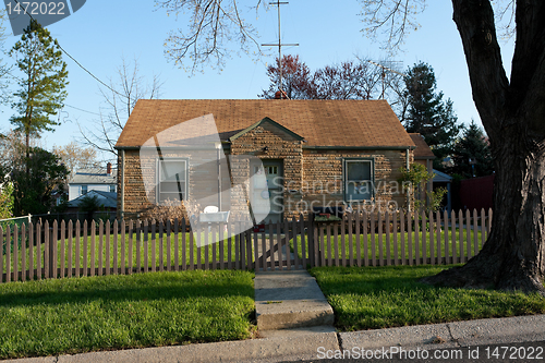 Image of Formstone Facade Cape Code House, Picket Fence, Suburban Marylan