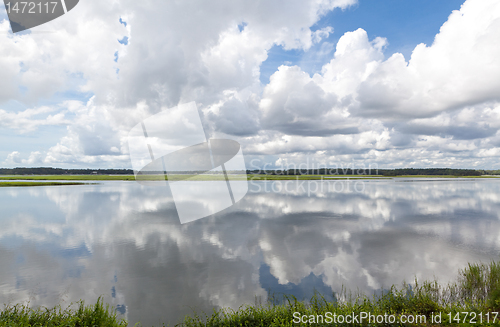 Image of Dramatic Puffy White Clouds Reflected Smooth May River Bluffton 