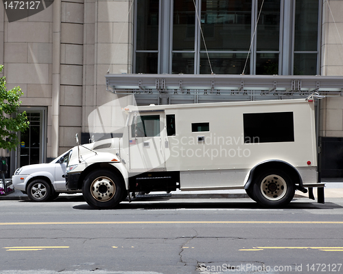 Image of Side View Armoured Armored Car Parked on Street Outside Building