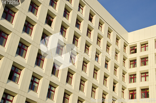 Image of Hospital building with many windows backdrop.