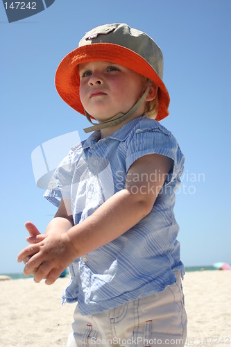 Image of Blonde boy playing on the beach