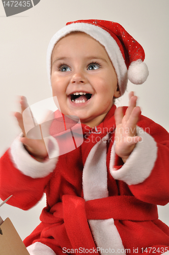 Image of happy clapping baby girl