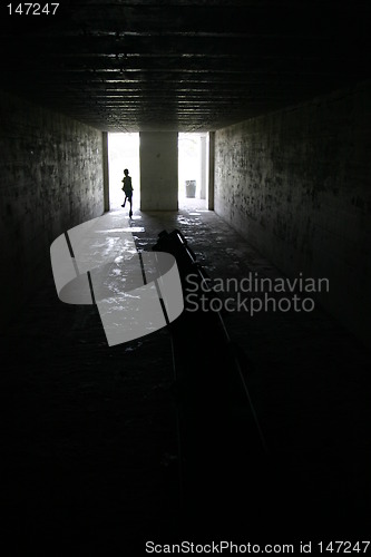 Image of Child running in dark room in Fort Desoto, Florida