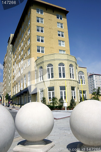 Image of Hotel with three large sphere sculptures in foreground