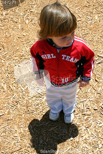 Image of Brunette girl standing at playground