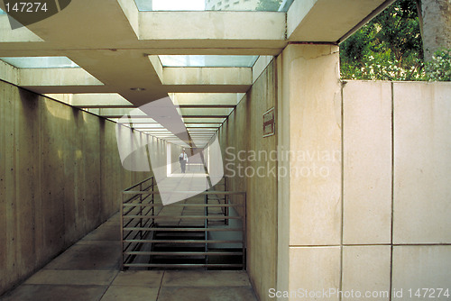 Image of Man in business suit walking in underground tunnel