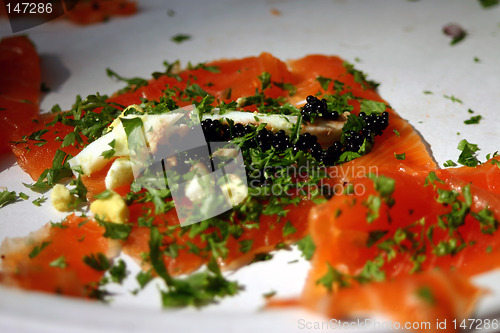 Image of Sashimi salmon with boiled egg, caviar, and parsley