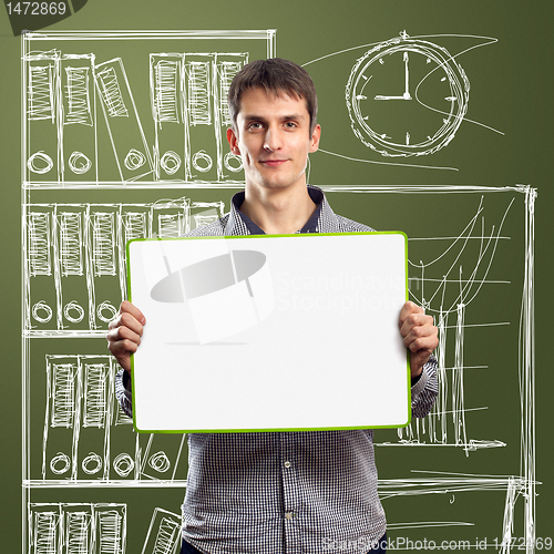 Image of male with write board in his hands