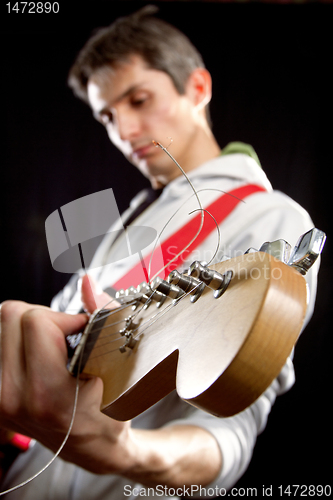 Image of male with guitar