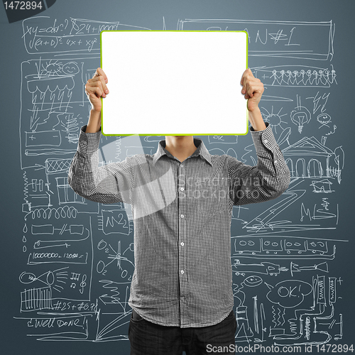 Image of male with write board in his hands