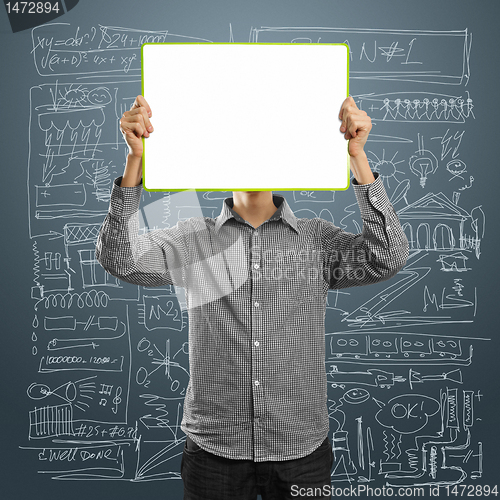 Image of male with write board in his hands