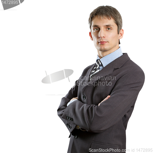 Image of male in suit with folded hands