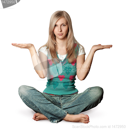 Image of woman in lotus pose with open hands