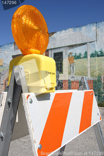 Image of Traffic barricade set against a painted wall