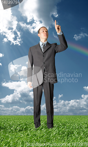 Image of full length businessman push the button outdoors