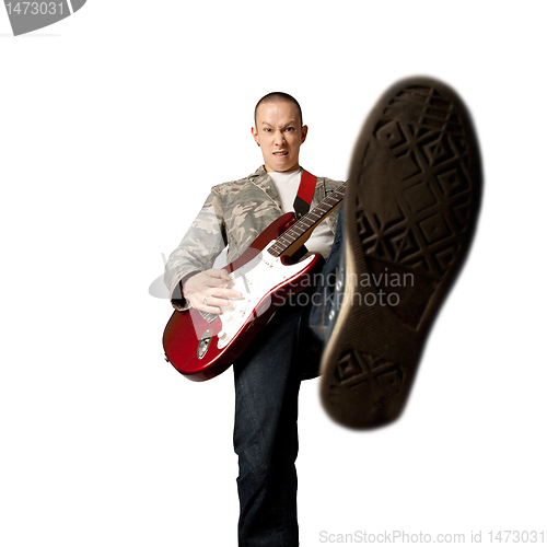 Image of rocker with guitar and foot