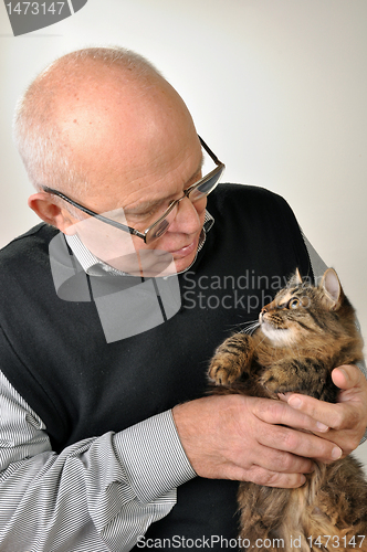 Image of senior man with a cat