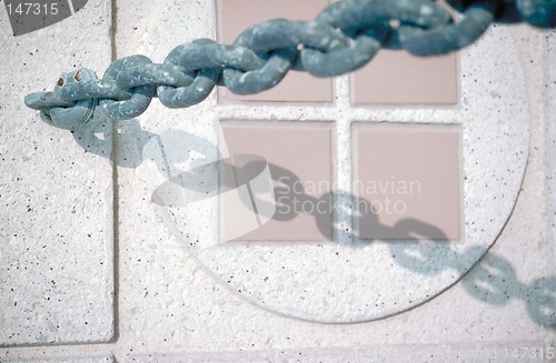 Image of Chain and ceramic tile detail