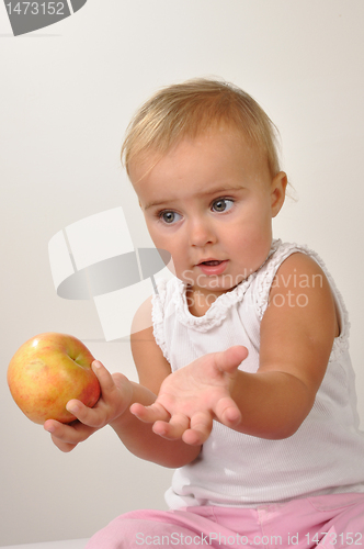 Image of beautiful child with an apple