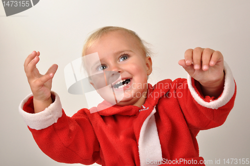 Image of happy Christmas baby with hands raised