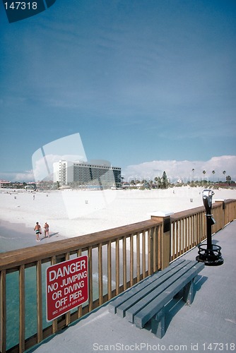 Image of Boardwalk, bench, and sign at the beach