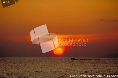 Image of Sunset with sportfishing boat