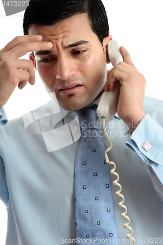 Image of Stressed  depressed man businessman on phone