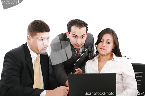 Image of business team looking shocked and worried when looking at the la
