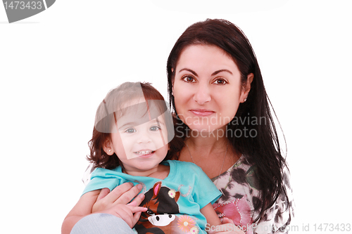 Image of Smiling embracing mom and daughter looking at camera 