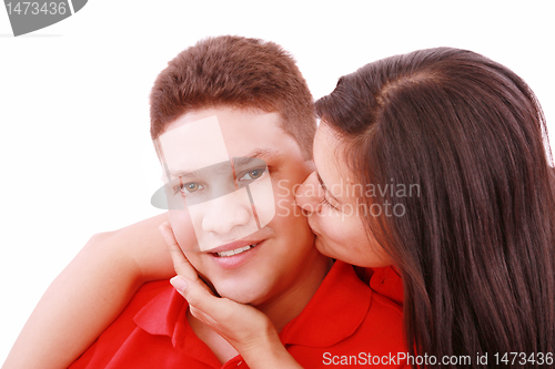 Image of Young woman kissing her boyfriend 