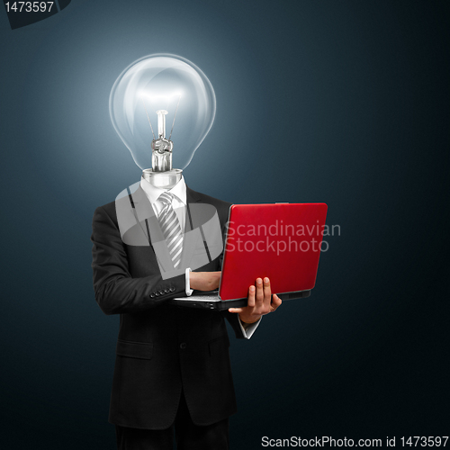 Image of lamp head businessman with laptop
