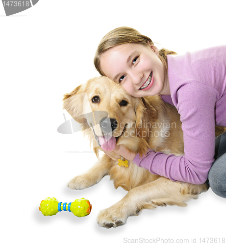 Image of Girl hugging golden retriever dog