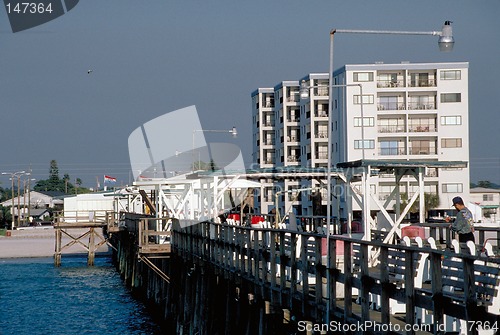 Image of Fishing pier with hotels in background