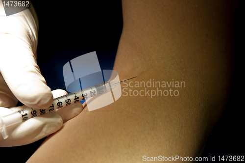 Image of Hand in white gloves handle insulin injection