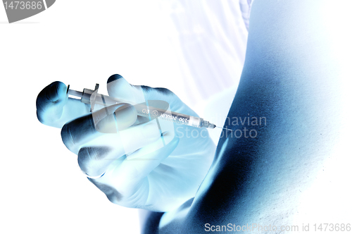 Image of Shaded injection insulin pen at hand