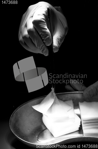 Image of Doctor trying catch white swab