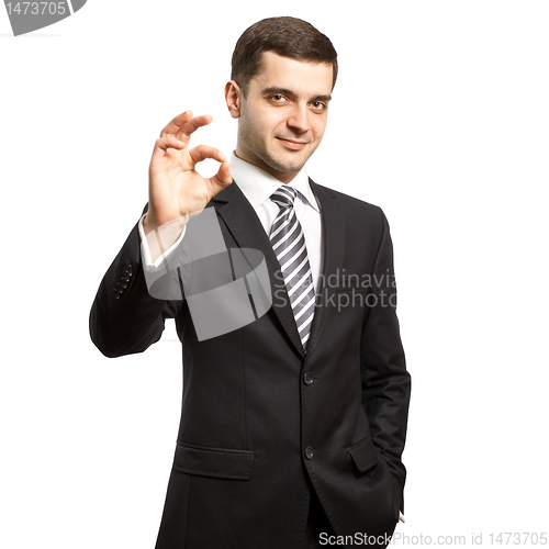 Image of happy businessman in suit shows OK