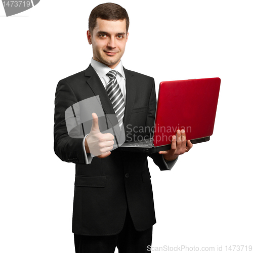 Image of male in suit with laptop in his hands