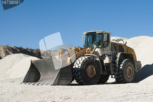 Image of Excavator in a limestone quarry