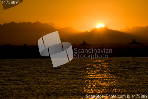 Image of seascape with orange sunset