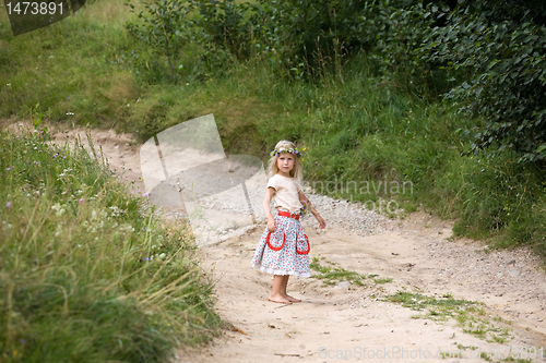 Image of little girl standing on the road