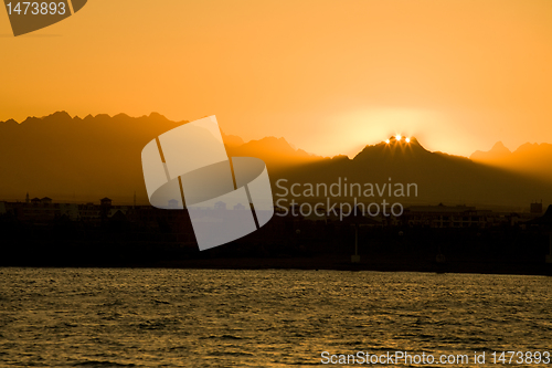 Image of seascape with orange sunrise