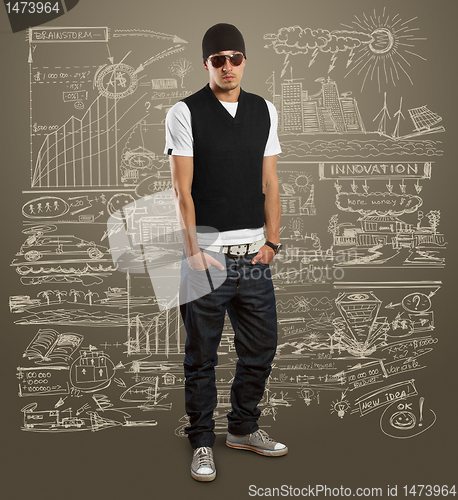 Image of stylish man in glasses looking at camera