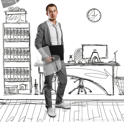 Image of male in with laptop in his hands