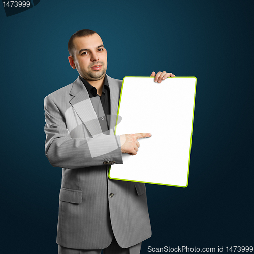 Image of happy businesswoman holding blank white card
